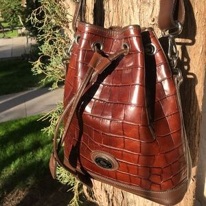 Dooney & Bourke brown drawstring leather purse.